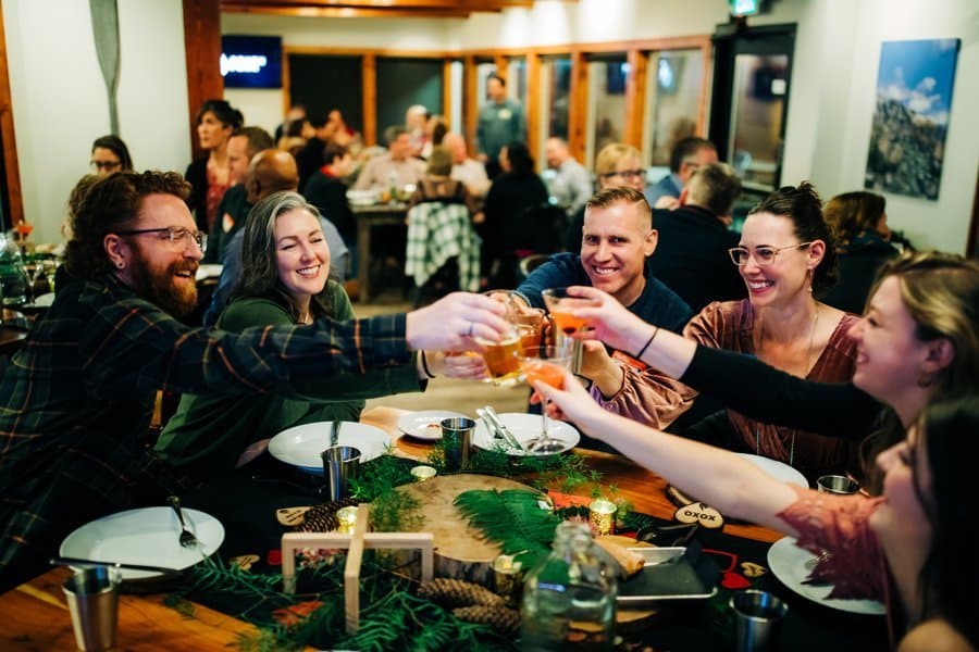 Guests raising a toast across the long table