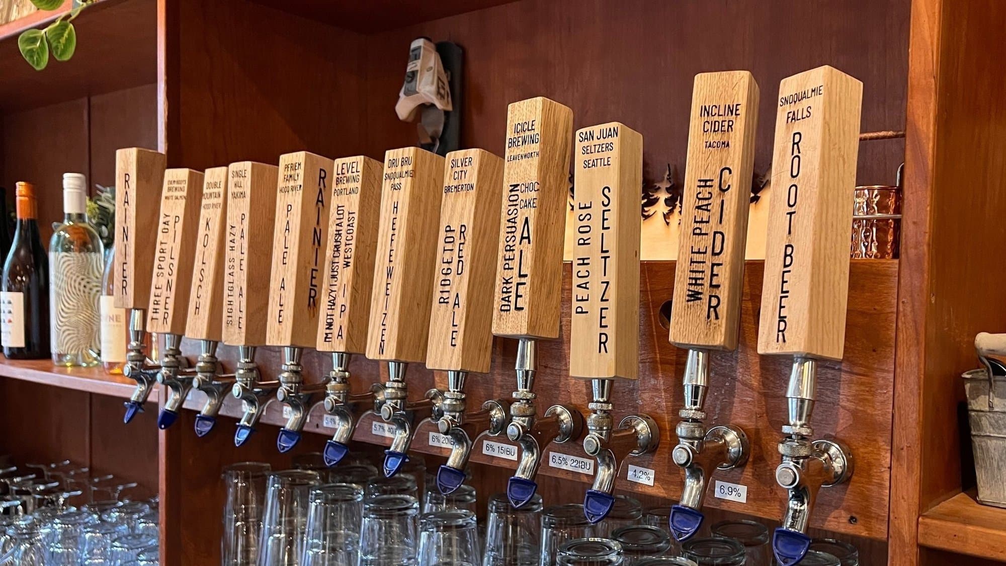 A row of wooden tap handles behind the bar