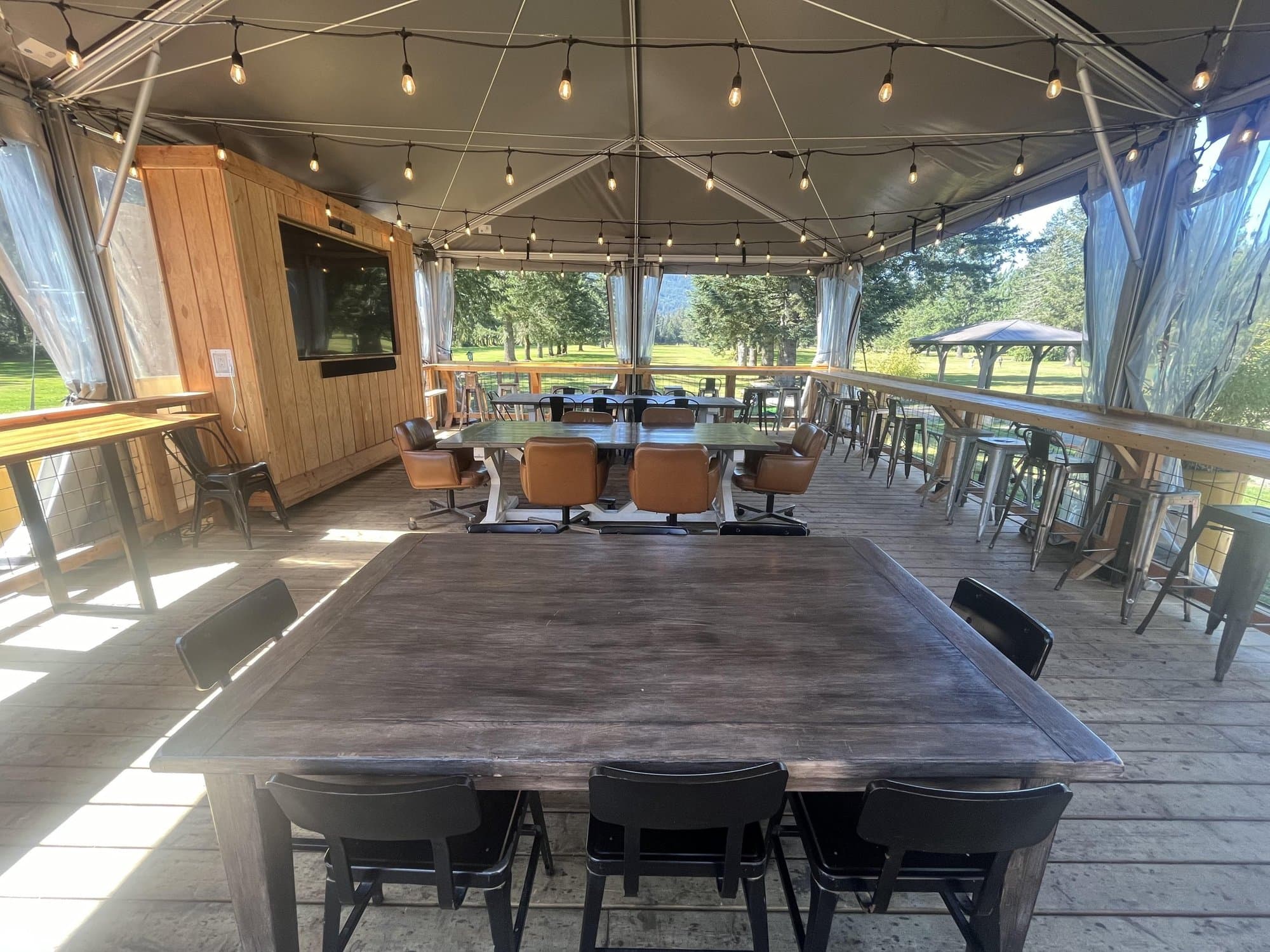 La Tienda tent set with tables under string lights